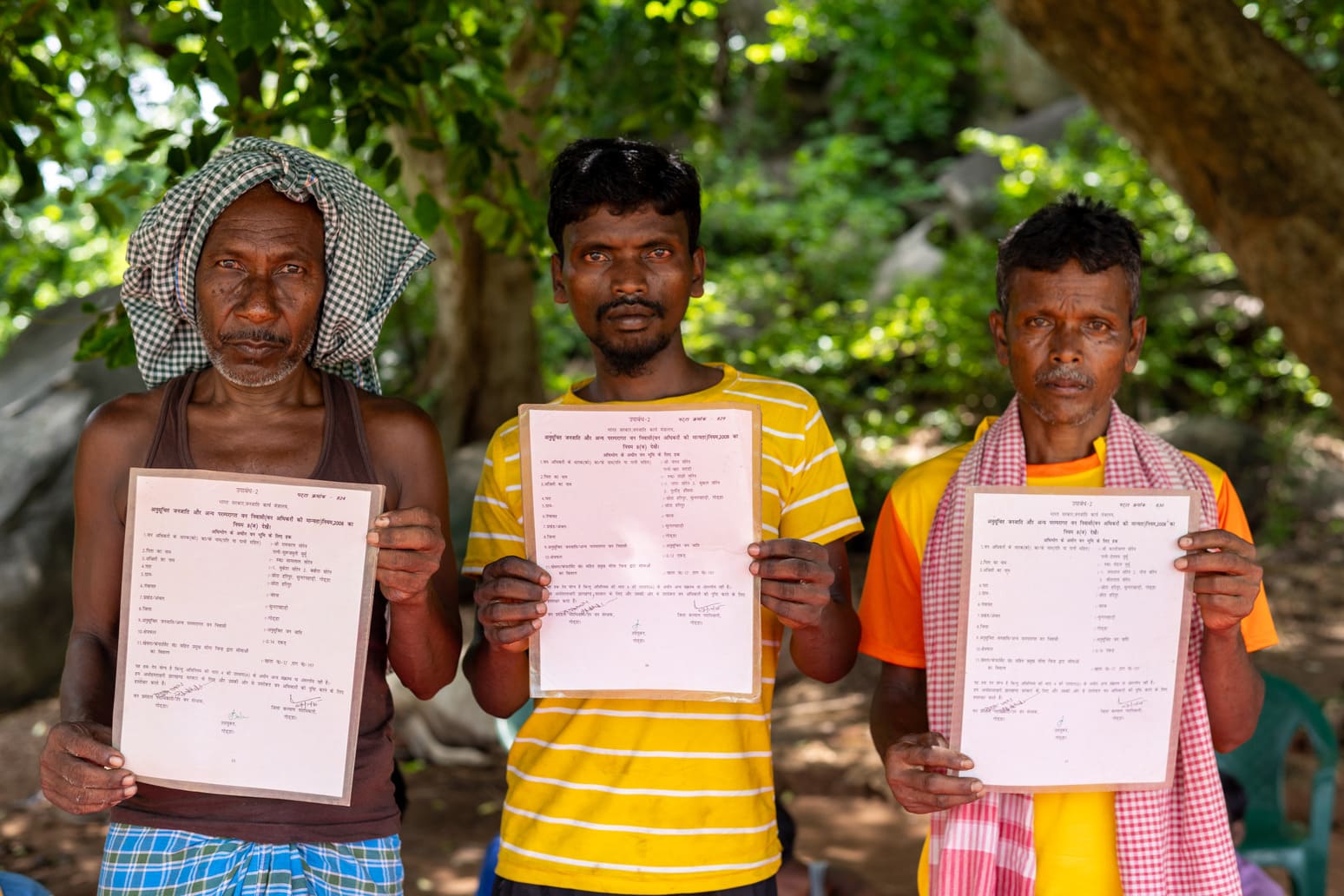 Community members holding documents